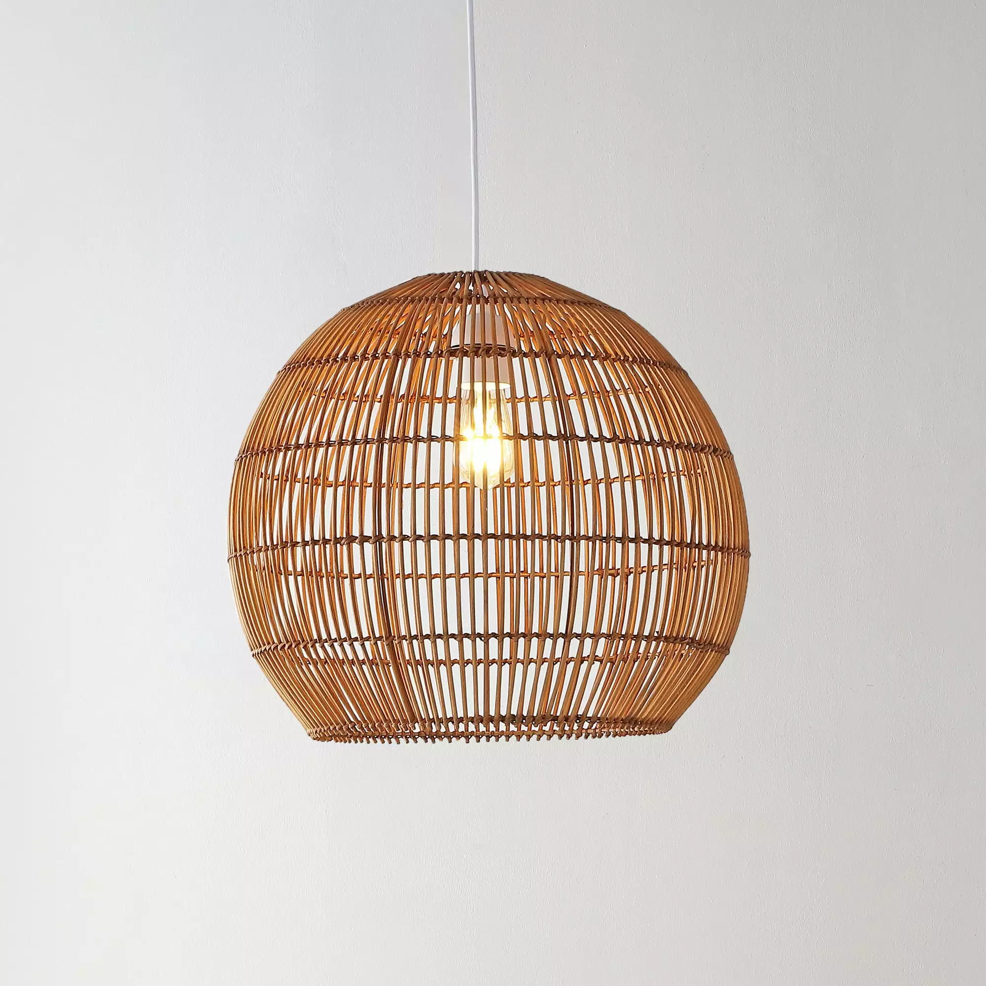 Raya 19 1-Light Farmhouse Coastal Rattan 180 Cord Plug-In or Hardwired LED Pendant. Brown